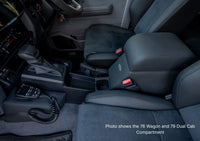 Interior of a vehicle showing the driver's seat and dashboard with various controls.